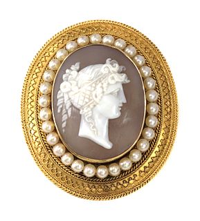 A Victorian gold archaeological revival, Etruscan style, shell cameo and split pearl brooch, c.1870,