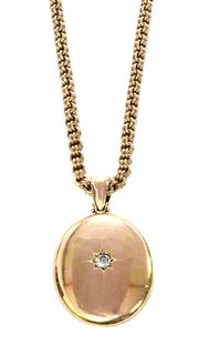 A Victorian gold diamond set locket and chain,