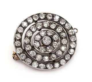 A late Victorian diamond set target brooch/pendant, c.1890,