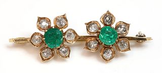 An emerald and diamond bar brooch,