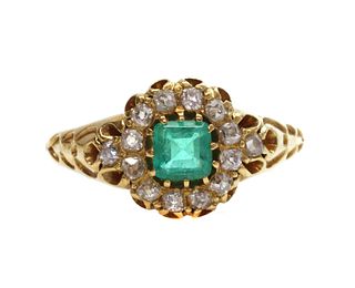 A late Victorian emerald and diamond cluster ring,