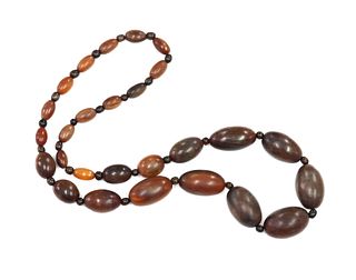 A single row graduated olive shaped buffalo horn bead necklace, c.1920,