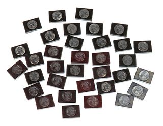 Thirty four glass intaglios plaques,