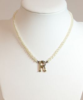 A single row pearl and diamond initial necklace,