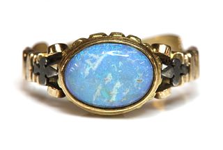 An antique style single stone opal ring,