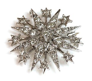 A 9ct white gold Victorian style diamond set star brooch/pendant,