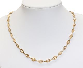 A gold hessonite garnet rivière necklace,