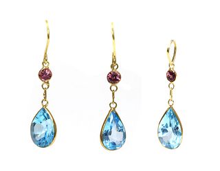 A blue topaz and garnet earrings and pendant suite,