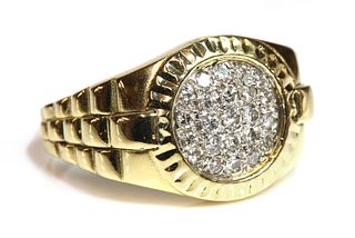 A gentlemen's 18ct two colour gold diamond set ring,