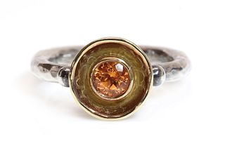 A silver and gold mandarin garnet ring, by Malcolm Morris,