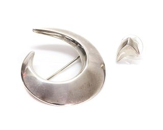 A sterling silver asymmetrical crescent brooch, by Georg Jensen,