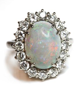 A white gold opal and diamond cluster ring,