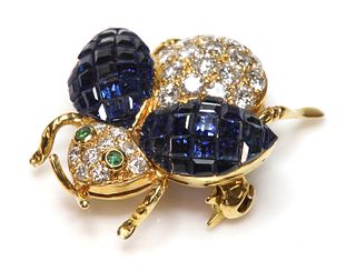 A gold sapphire, diamond and emerald insect brooch,
