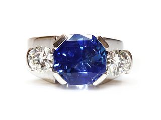 A platinum sapphire and diamond three stone ring,