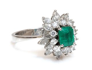 An emerald and diamond three tier cluster ring,