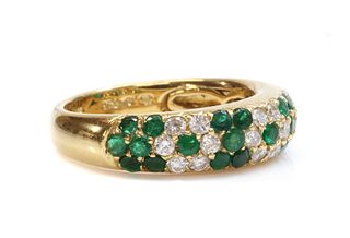 An 18ct gold emerald and diamond pavé set bombé form half hoop ring,