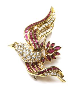 A gold diamond and ruby brooch,