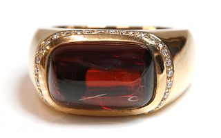 A rose gold garnet and diamond bombé ring,