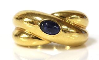 A single stone sapphire crossover band ring, by Cartier, c.1992,