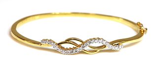 A high carat gold diamond set hinged bangle,