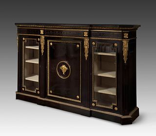 Napoleon III style credenza, last third of the nineteenth century. 
Ebonized wood, black marble top and bronze of later period. 
Presents scratches an