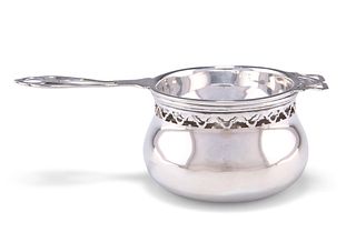 A GEORGE V SILVER TEA STRAINER AND BOWL, by Adie Brothers, Birmingham, date