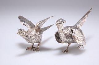 A PAIR OF ELIZABETH II CAST SILVER MODELS OF FIGHTING COCK PHEASANTS, by Ed