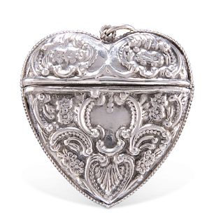 A VICTORIAN SILVER HEART SHAPED CASE, Birmingham 1854, cast with C-scrolls 