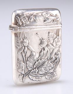 A JAPANESE WHITE METAL VESTA CASE, unmarked, c.1900, chased with flowering 