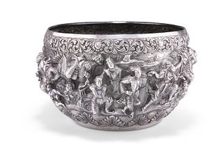 A LARGE BURMESE SILVER BOWL, 19TH CENTURY, typically chased in high relief 