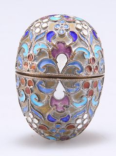 A RUSSIAN SILVER AND ENAMEL EGG, marks indistinct, with hinged cover. 3.5cm