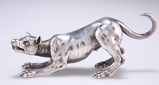 A WHITE METAL MODEL OF A HOUND, LATE 19TH CENTURY, unmarked, cast in a fear