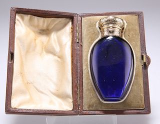 A VICTORIAN GOLD-MOUNTED BLUE-GLASS SCENT BOTTLE, by Diller, with foliate a
