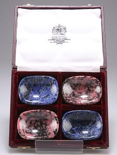 A SET OF FOUR HARDSTONE SALTS, of rounded rectangular form, in an Asprey bo