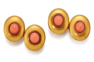 A PAIR OF CORAL DOUBLE CUFFLINKS, oval heads inset with oval coral, connect