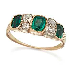 AN EMERALD AND DIAMOND RING, three octagonal-cut emeralds spaced by pairs o