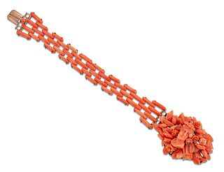 A 19TH CENTURY ITALIAN CORAL BRACELET, the central section carved to depict