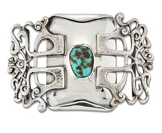 OLIVER BAKER FOR LIBERTY & CO - A SILVER AND TURQUOISE BUCKLE, the rectangu