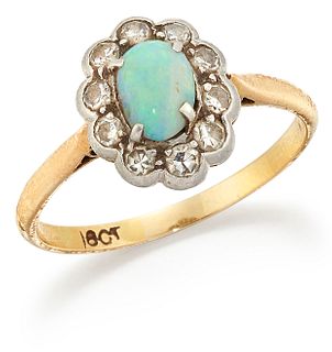 AN OPAL AND DIAMOND CLUSTER RING, an oval opal within a border of eight-cut