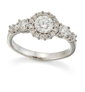 A DIAMOND RING, a round brilliant-cut diamond within a diamond border and s