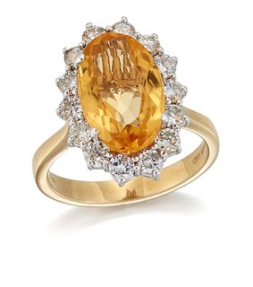 AN 18 CARAT GOLD CITRINE AND DIAMOND CLUSTER RING, an oval-cut citrine in a