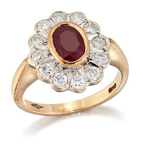 A 9 CARAT GOLD RUBY AND DIAMOND CLUSTER RING, an oval-cut ruby in a bezel s