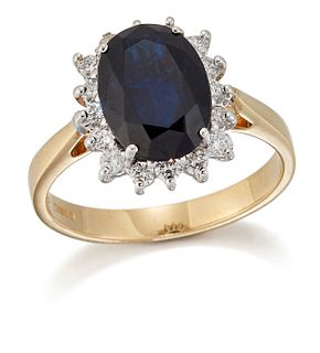 AN 18 CARAT GOLD SAPPHIRE AND DIAMOND CLUSTER RING, an oval-cut sapphire in