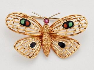 A RUBY AND ENAMEL BUTTERFLY BROOCH, modelled with a round-cut ruby thorax a