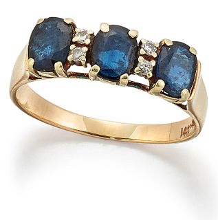 A SAPPHIRE AND DIAMOND RING, three oval-cut sapphires spaced by pairs of ro
