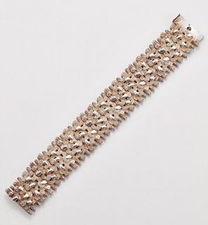 A MODERNIST SILVER BRACELET, of heavily textured bark links with textured, 