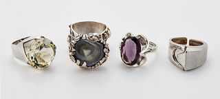 FOUR MODERNIST SILVER RINGS, including A MEXICAN SILVER PURPLE PASTE RING, 