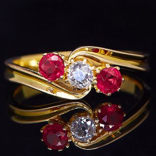 NO RESERVE, RUBY AND DIAMOND 3-STONE TWIST RING