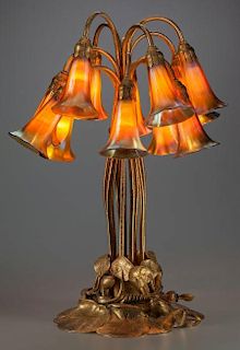 TIFFANY STUDIOS GILT BRONZE AND FAVRILE GLASS TWELVE-LIGHT LILY LAMP