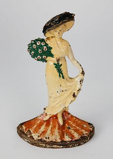 Vintage Painted Cast Iron Doorstop of Lady Holding a Bouquet